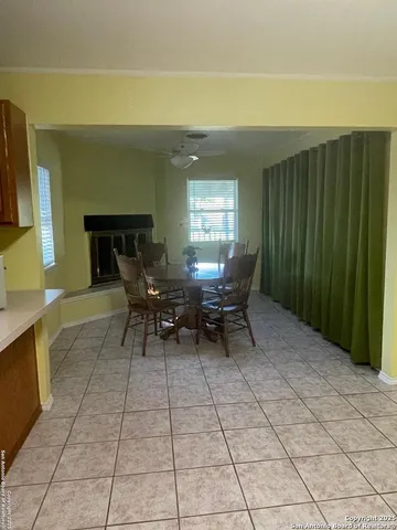 a view of a chairs and table in a room