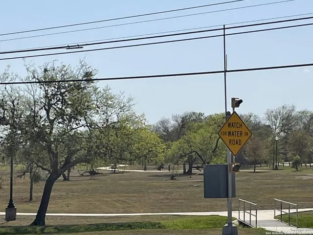 a view of a swimming pool with outdoor seating and yard