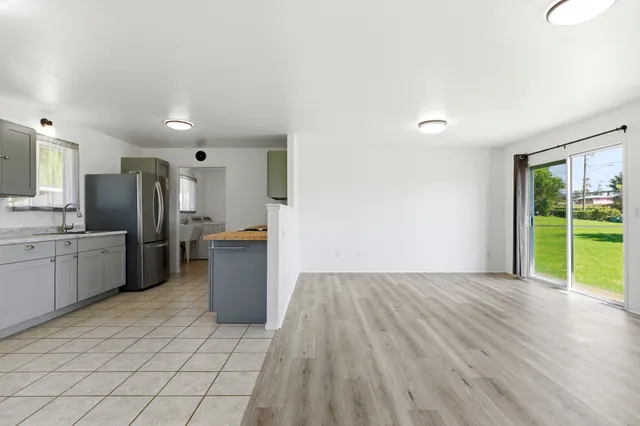 a kitchen with stainless steel appliances a refrigerator and a sink