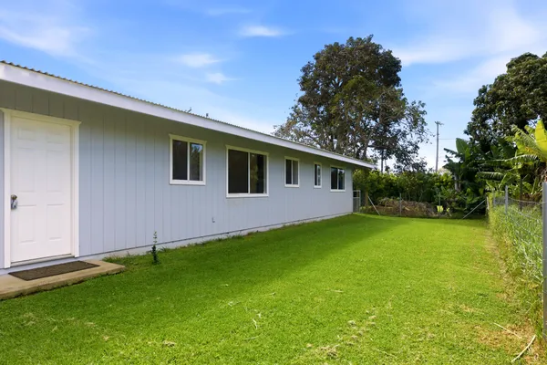 a backyard of a house with lots of green space