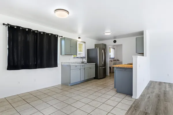 a kitchen with stainless steel appliances a refrigerator and a stove
