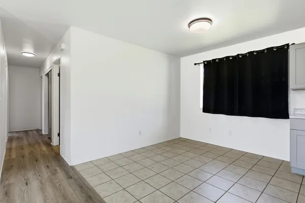 a view of a livingroom with wooden floor
