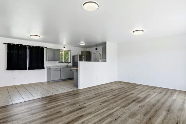 a view of a kitchen with microwave and cabinets