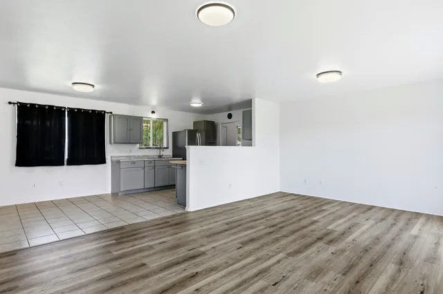 a view of a kitchen with microwave and cabinets