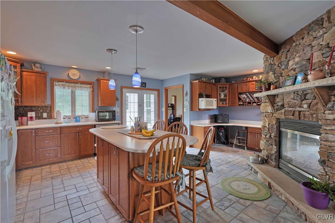 1205 Pine Run Road Lehighton, PA 18235 - Photo 14 of 39 a kitchen with stainless steel appliances granite countertop a stove a sink and a refrigerator