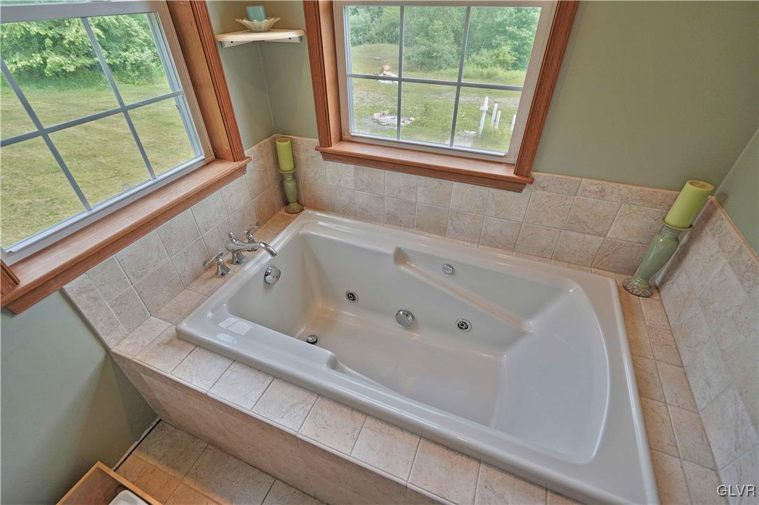 1205 Pine Run Road Lehighton, PA 18235 - Photo 20 of 39 a bathroom with a bathtub and a window