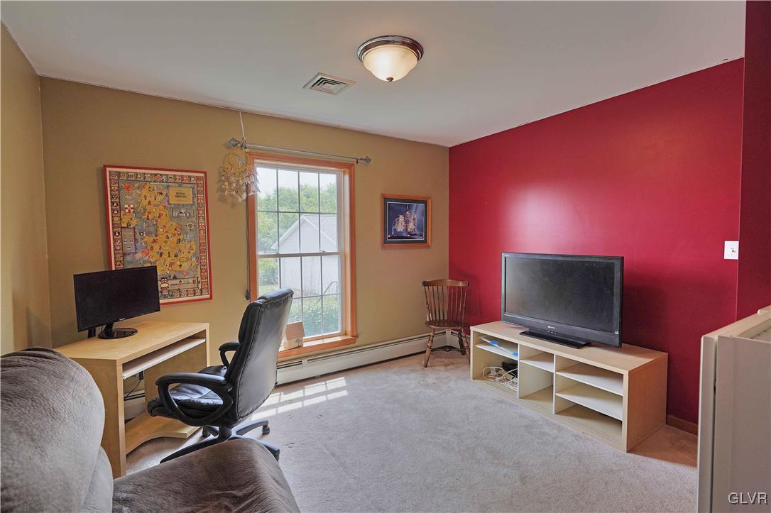 1205 Pine Run Road Lehighton, PA 18235 - Photo 22 of 39 a view of a livingroom with furniture and a flat screen tv