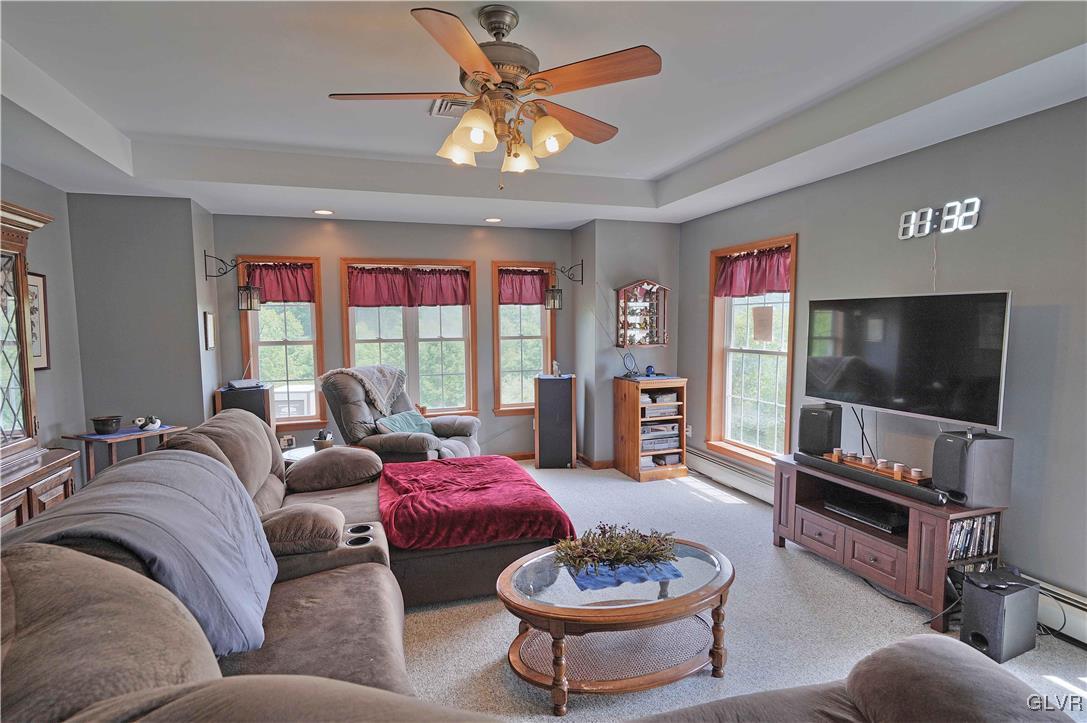 1205 Pine Run Road Lehighton, PA 18235 - Photo 10 of 39 a living room with furniture a flat screen tv and a large window