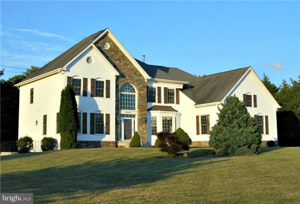 21000 Brooke Knolls Road Laytonsville, MD 20882 - Photo 1 of 20 a front view of a house with a yard