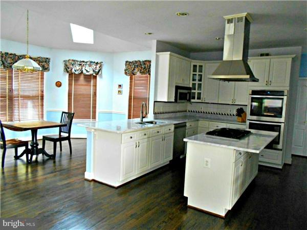21000 Brooke Knolls Road Laytonsville, MD 20882 - Photo 11 of 20 a kitchen with stove and cabinets