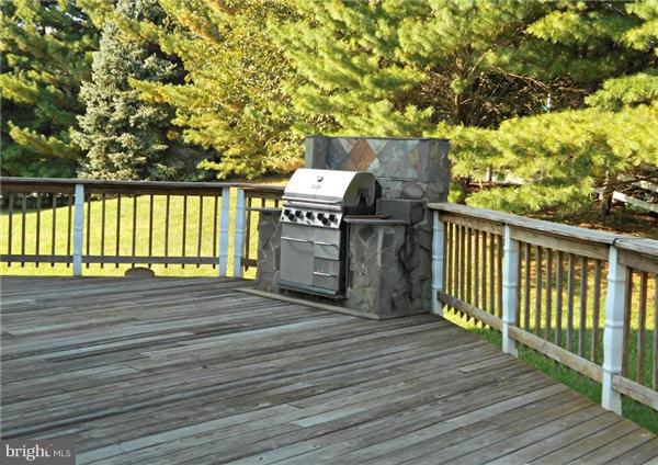 21000 Brooke Knolls Road Laytonsville, MD 20882 - Photo 5 of 20 a view of a deck with wooden floor and fence