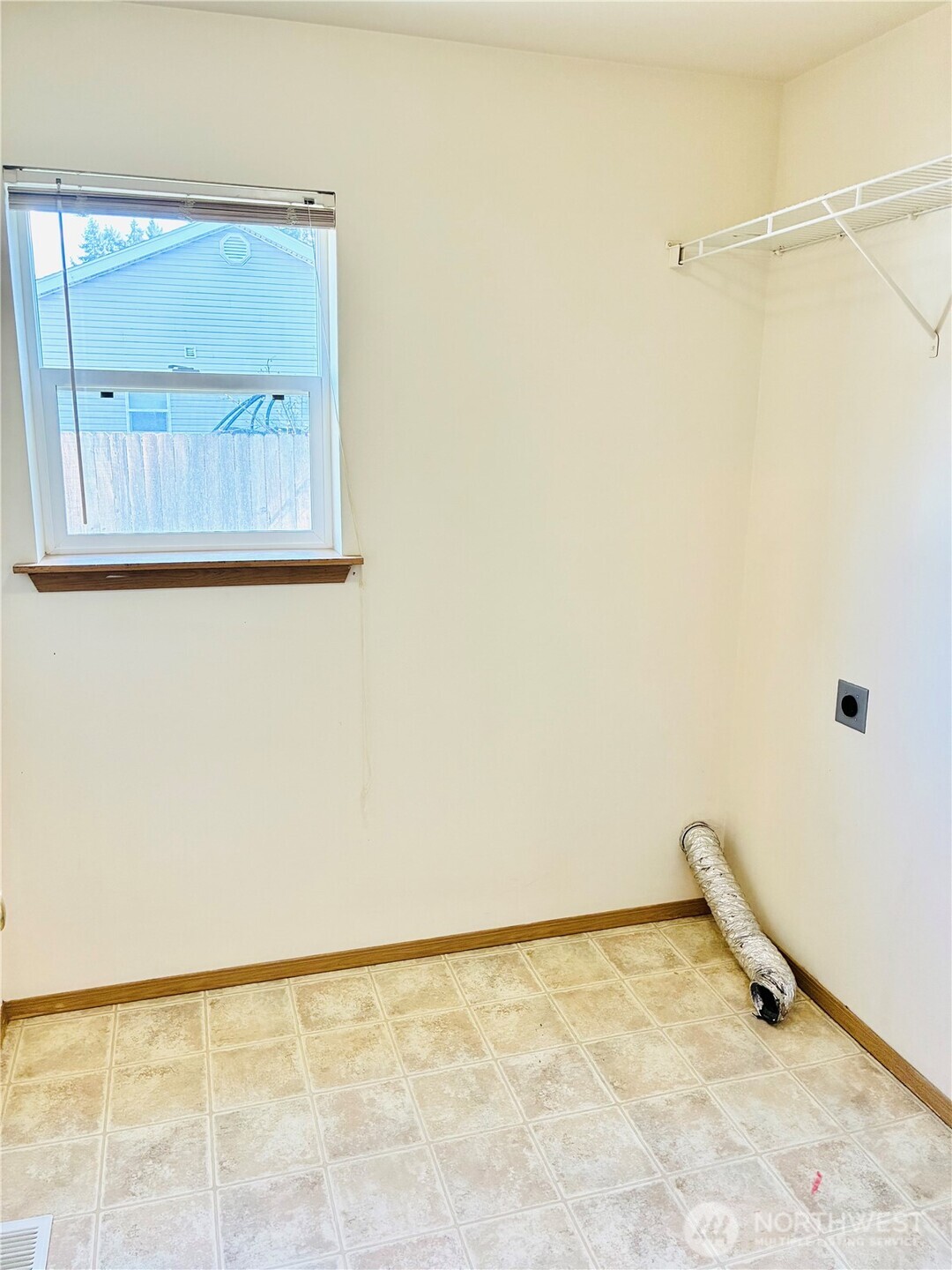 8802 222nd Street East Graham, WA 98338 - Photo 16 of 25 a view of a room with cabinet and a window
