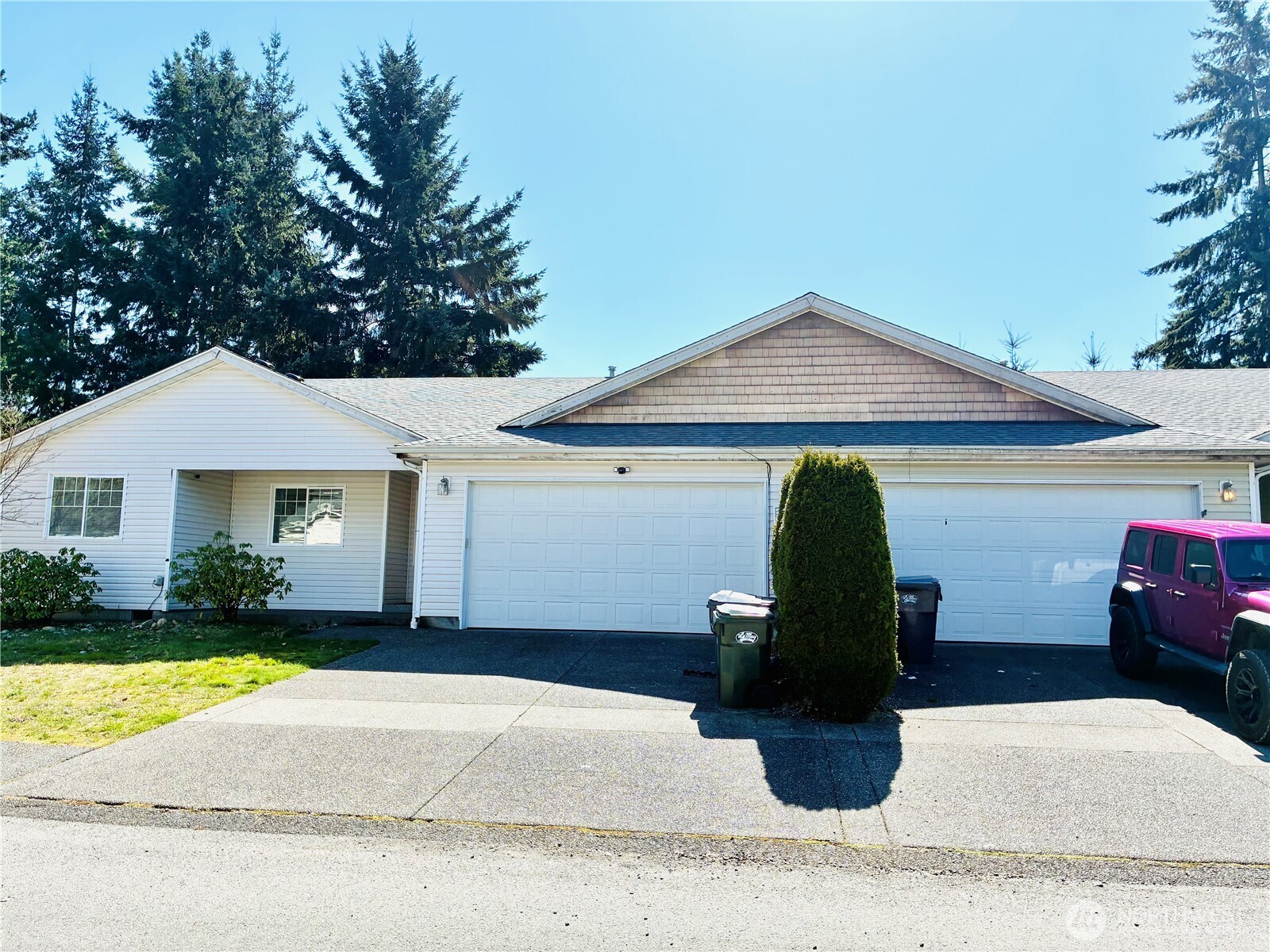 8802 222nd Street East Graham, WA 98338 - Photo 2 of 25 a view of a house with backyard and garden