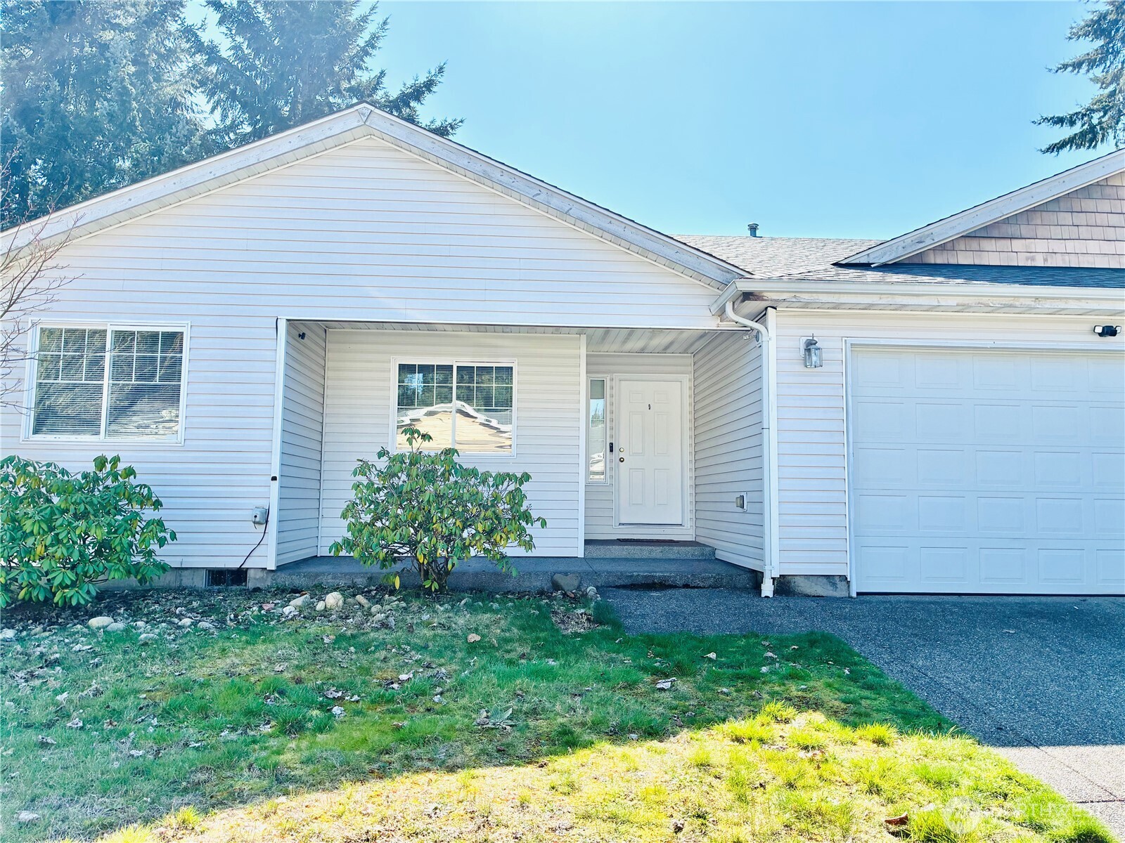 8802 222nd Street East Graham, WA 98338 - Photo 3 of 25 a front view of house with a garden
