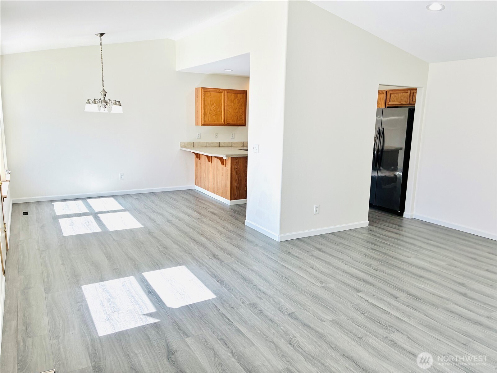 8802 222nd Street East Graham, WA 98338 - Photo 6 of 25 a view of an empty room and wooden floor
