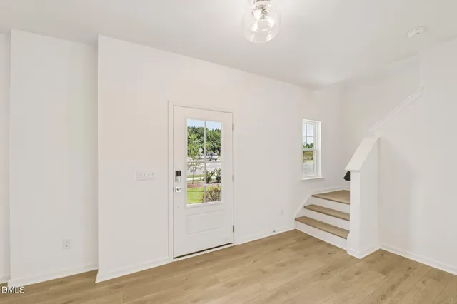 a view of a kitchen with a sink and a window