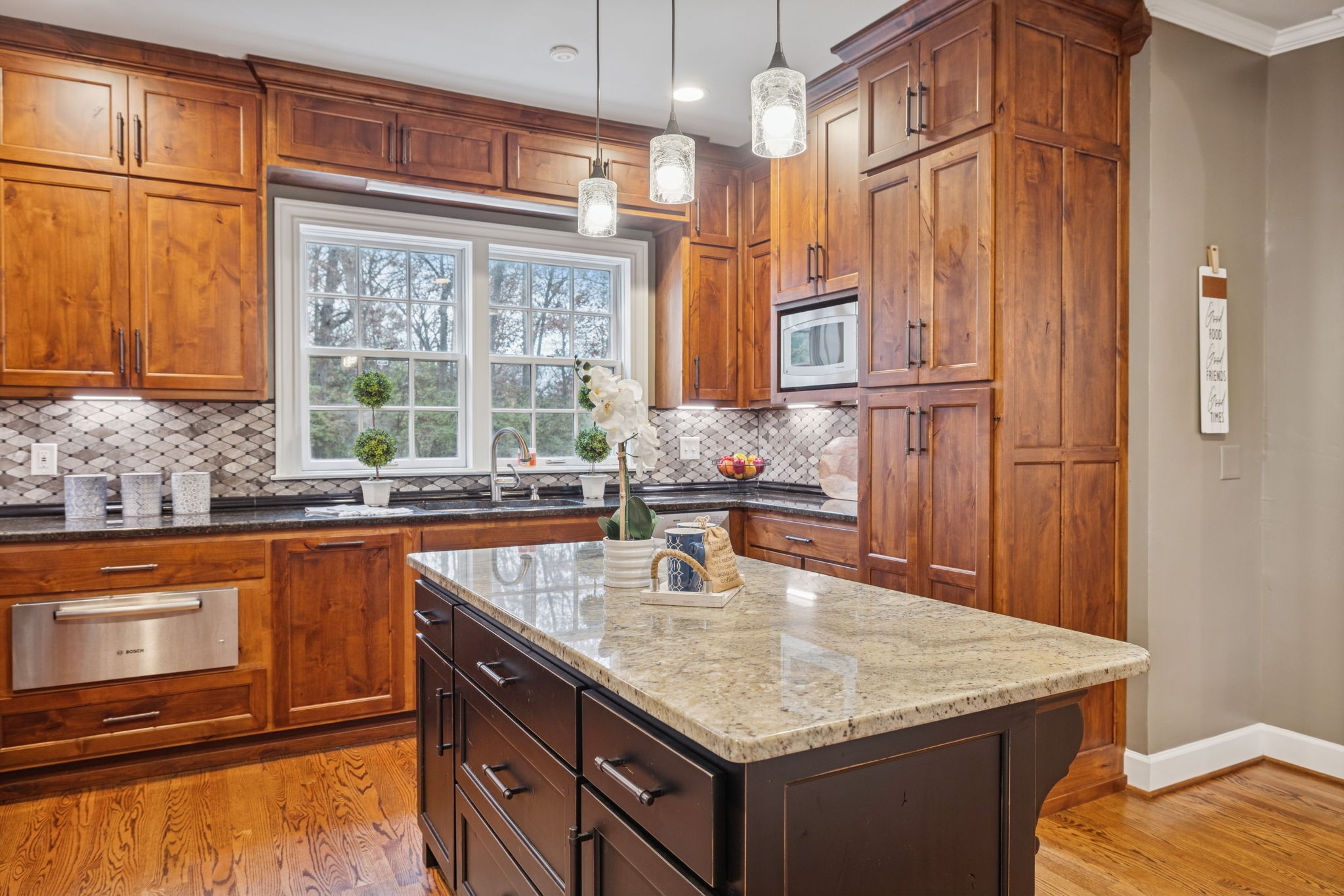 6012 Hickory Valley Road Nashville, TN 37209 - Photo 16 of 60 a kitchen with stainless steel appliances granite countertop a sink and a granite counter tops