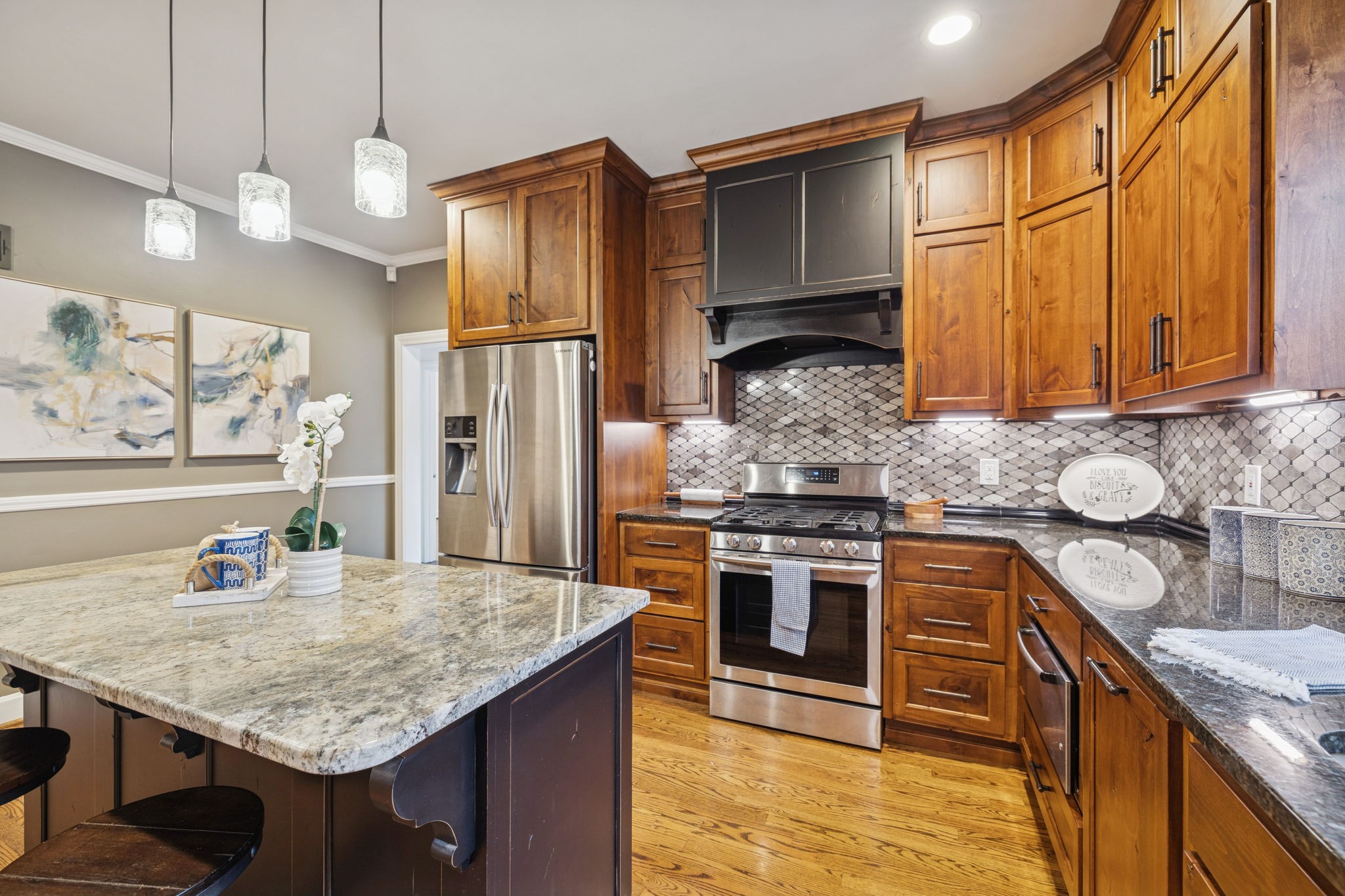6012 Hickory Valley Road Nashville, TN 37209 - Photo 18 of 60 a kitchen with stainless steel appliances granite countertop a sink refrigerator and cabinets
