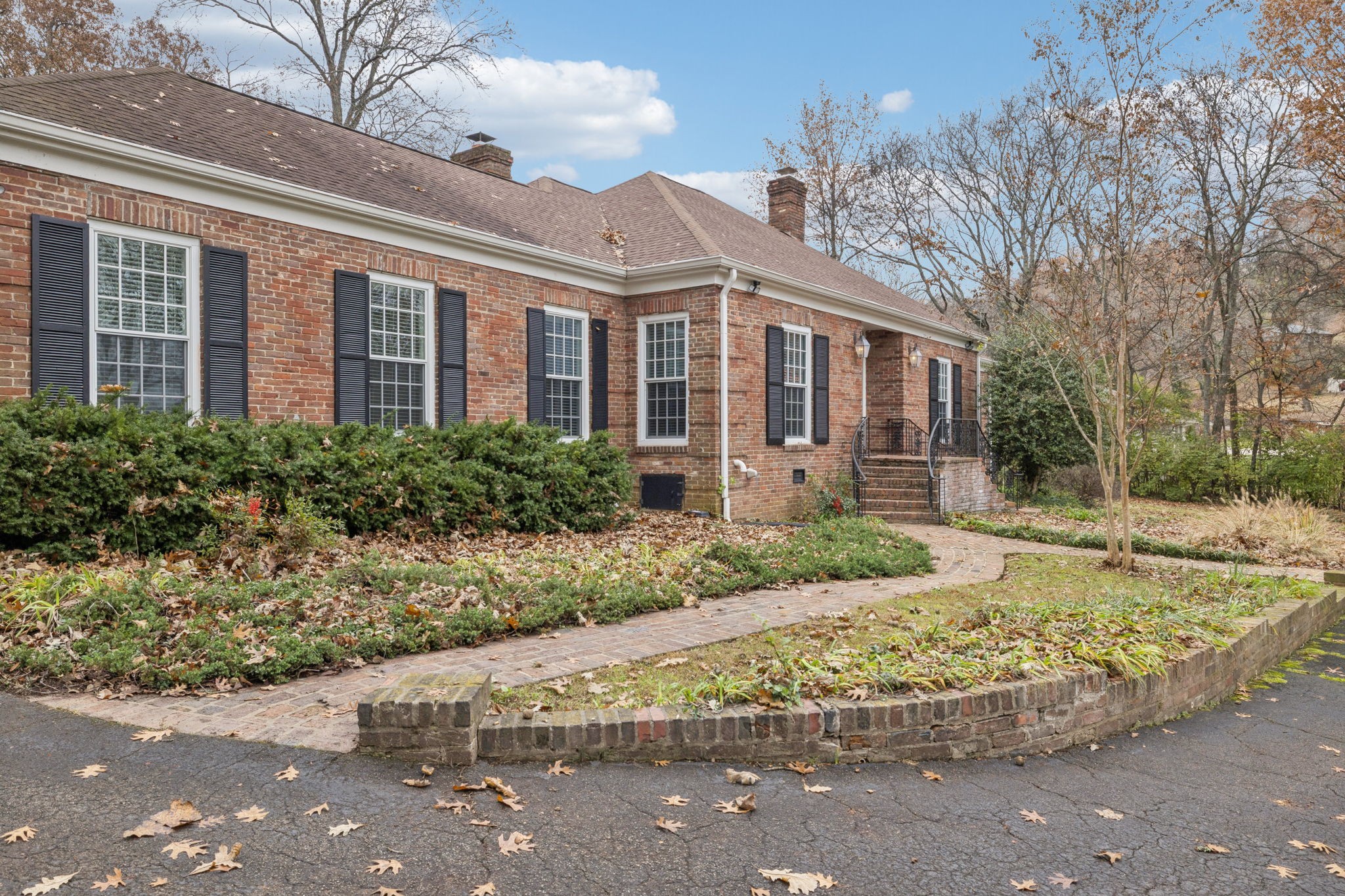 6012 Hickory Valley Road Nashville, TN 37209 - Photo 2 of 60 a front view of a house with garden
