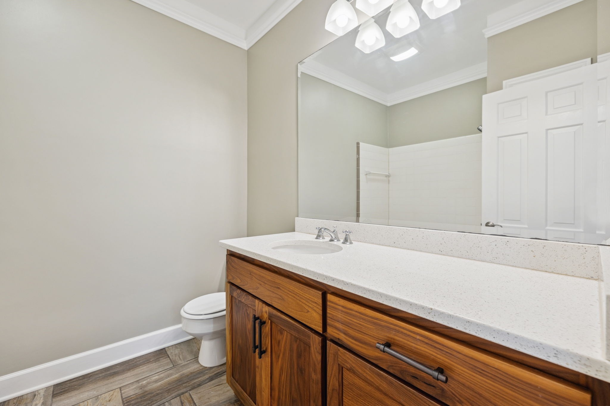 6012 Hickory Valley Road Nashville, TN 37209 - Photo 26 of 60 a bathroom with a sink a toilet and a mirror