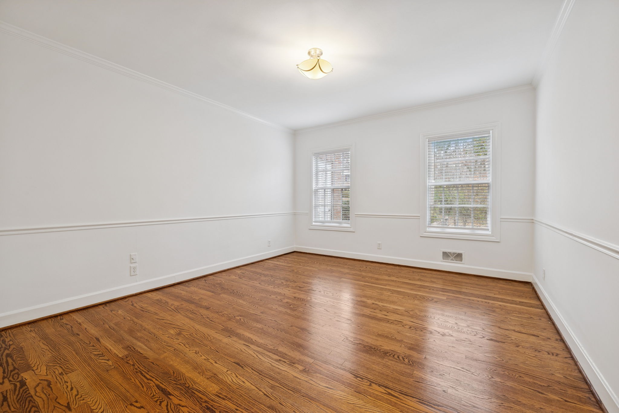 6012 Hickory Valley Road Nashville, TN 37209 - Photo 29 of 60 a view of an empty room with wooden floor and a window