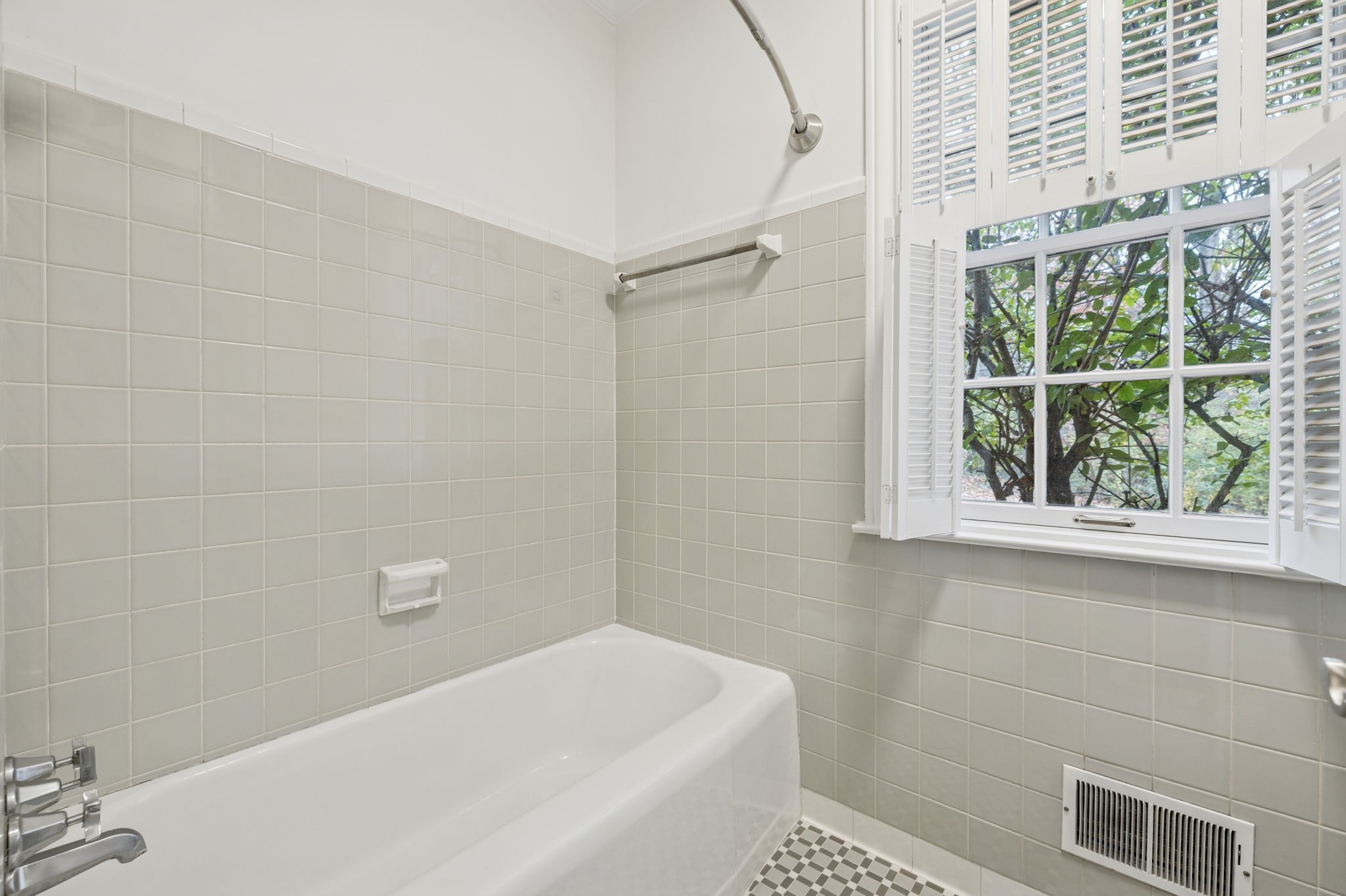 6012 Hickory Valley Road Nashville, TN 37209 - Photo 32 of 60 a bathroom with a bathtub and window