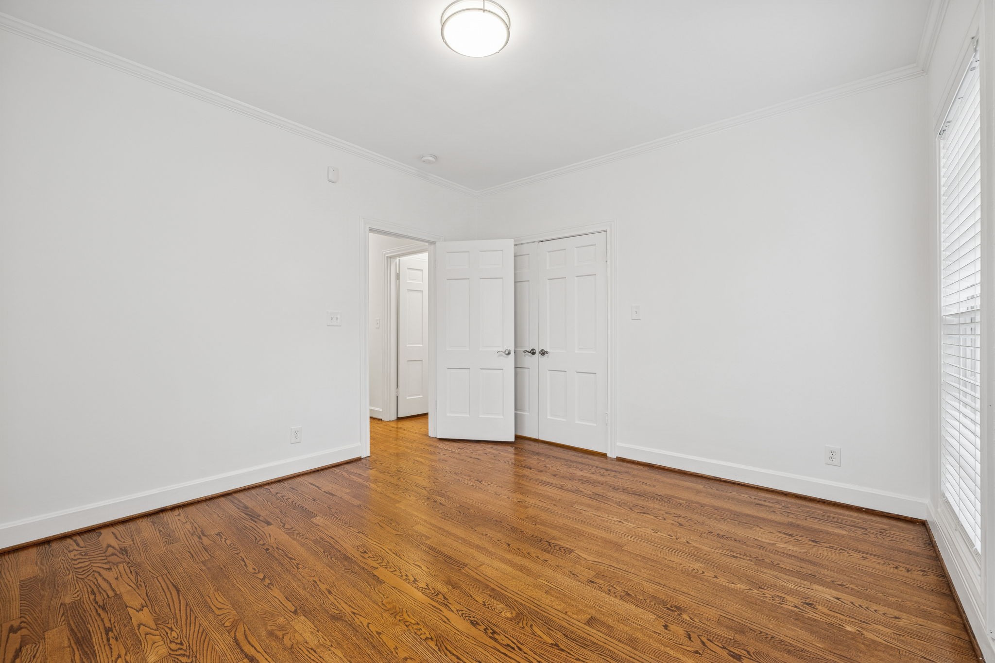 6012 Hickory Valley Road Nashville, TN 37209 - Photo 38 of 60 an empty room with wooden floor and windows