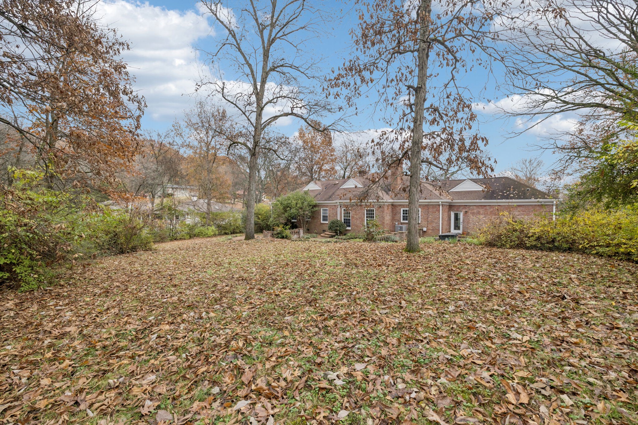 6012 Hickory Valley Road Nashville, TN 37209 - Photo 44 of 60 a view of a large house with a yard and large tree