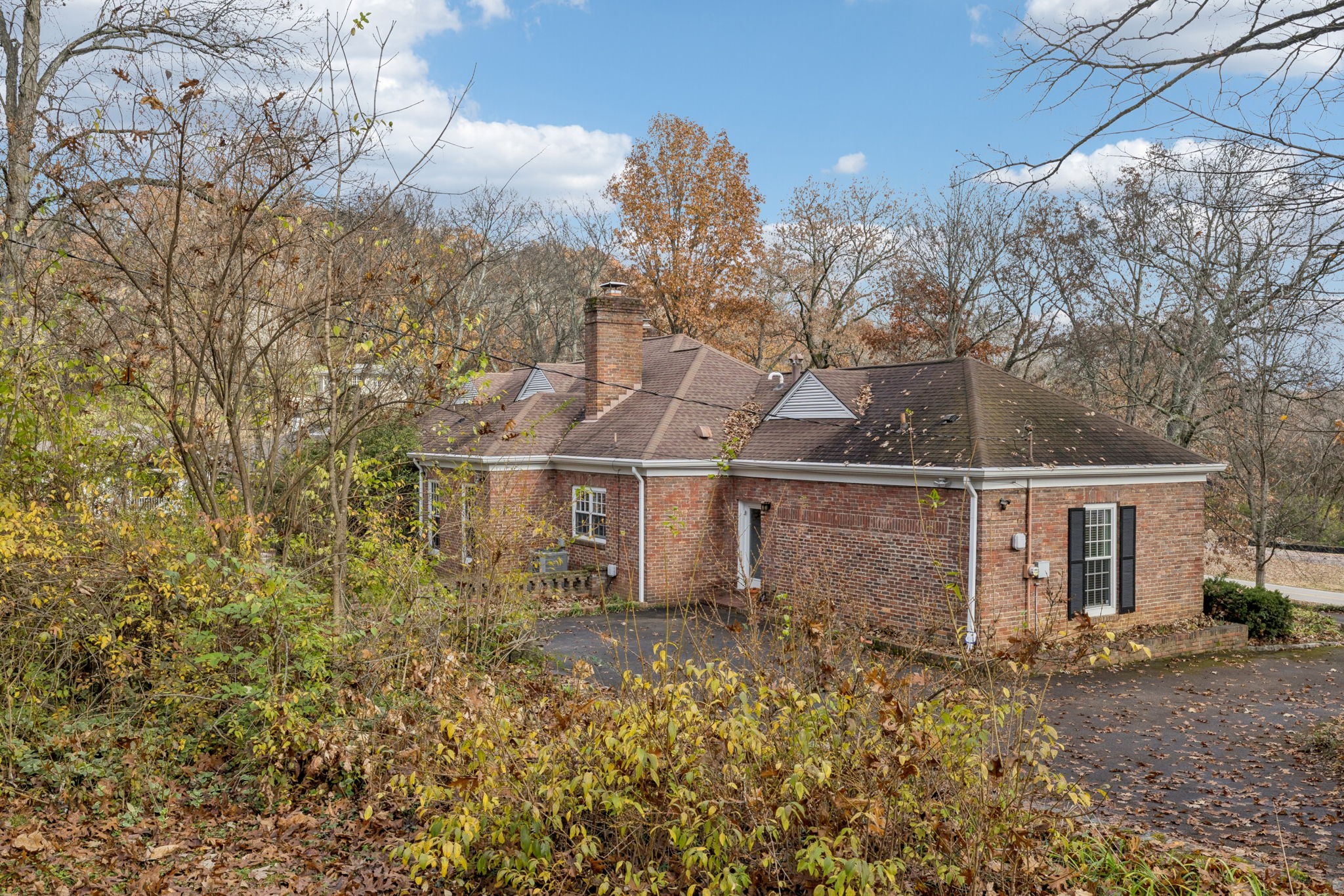 6012 Hickory Valley Road Nashville, TN 37209 - Photo 50 of 60 a view of a large house with a large tree and a yard