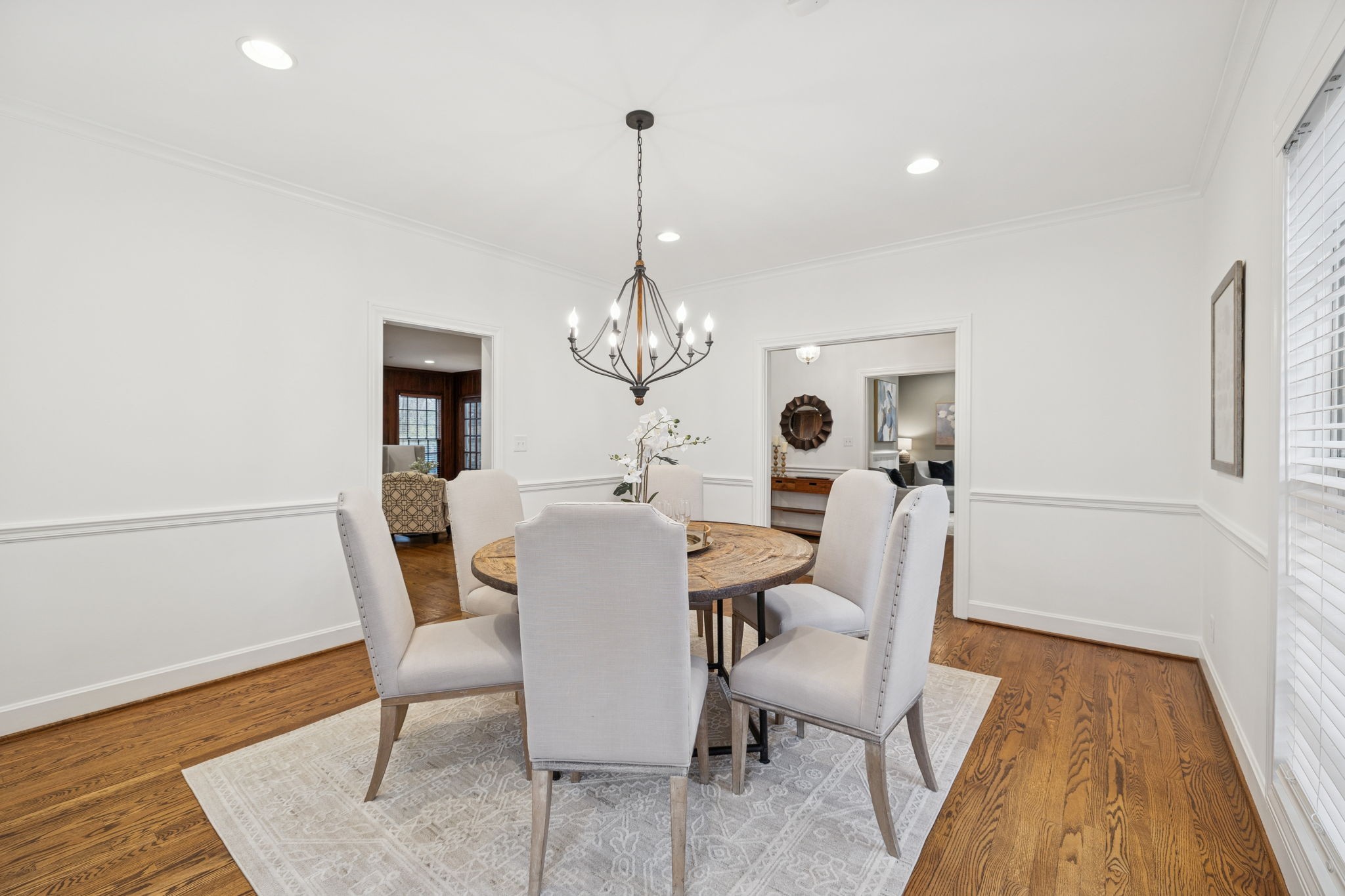 6012 Hickory Valley Road Nashville, TN 37209 - Photo 10 of 60 a view of a dining room with furniture a rug and wooden floor