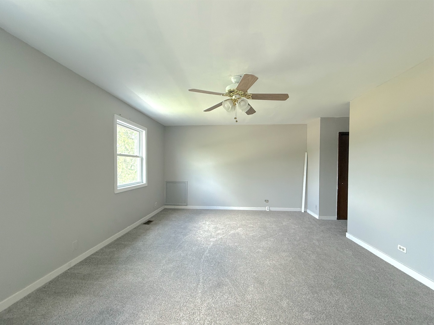3542 Ronald Road Crete, IL 60417 - Photo 17 of 22 a view of a livingroom with a ceiling fan and window