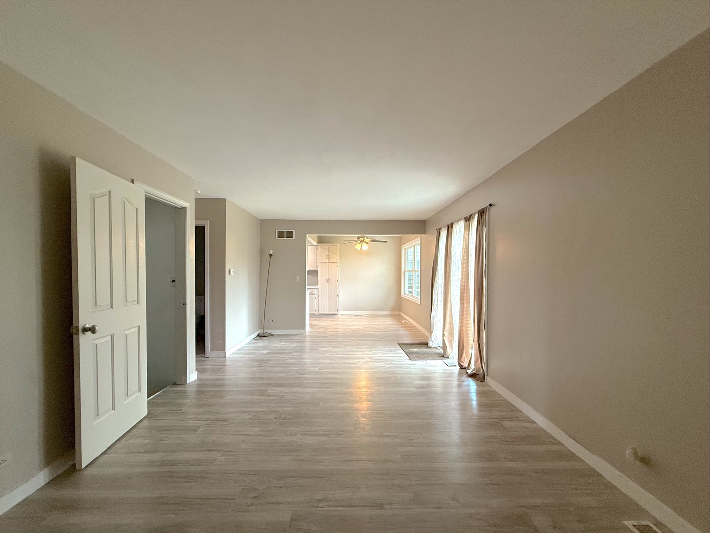 3542 Ronald Road Crete, IL 60417 - Photo 7 of 22 a view of empty room with wooden floor and fan