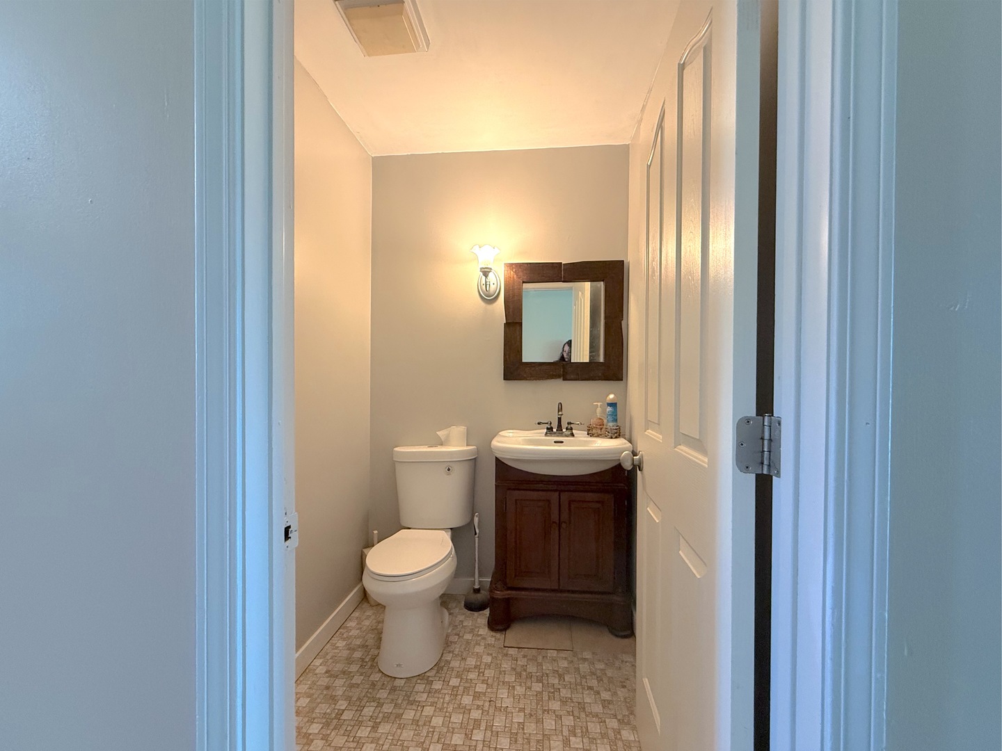 3542 Ronald Road Crete, IL 60417 - Photo 9 of 22 a bathroom with a toilet a sink and mirror