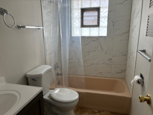 372 Yates Avenue, Unit 3 Calumet City, IL 60409 - Photo 12 of 12 a bathroom with a sink a toilet and a bathtub