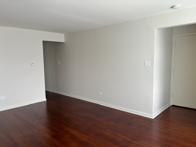 372 Yates Avenue, Unit 3 Calumet City, IL 60409 - Photo 4 of 12 a view of an empty room with wooden floor