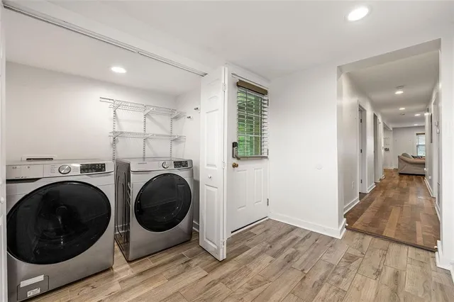 a view of a hallway with washer and dryer
