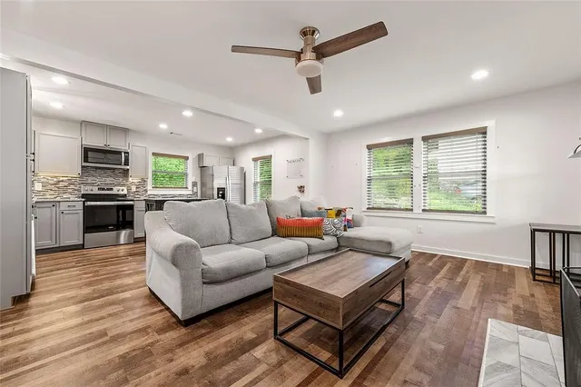 a living room with furniture and a window