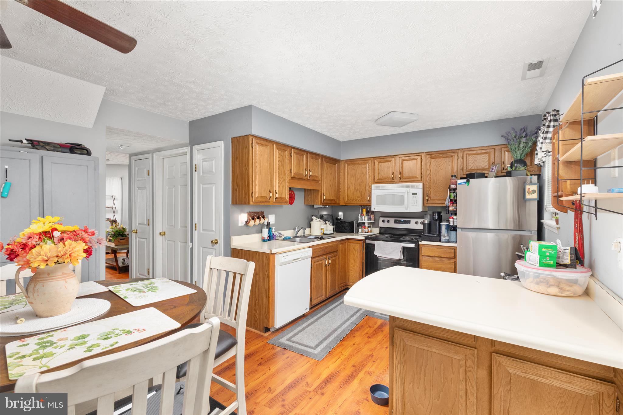 132 Stadium Circle Inwood, WV 25428 - Photo 4 of 25 a kitchen that has a lot of cabinets a sink and appliances