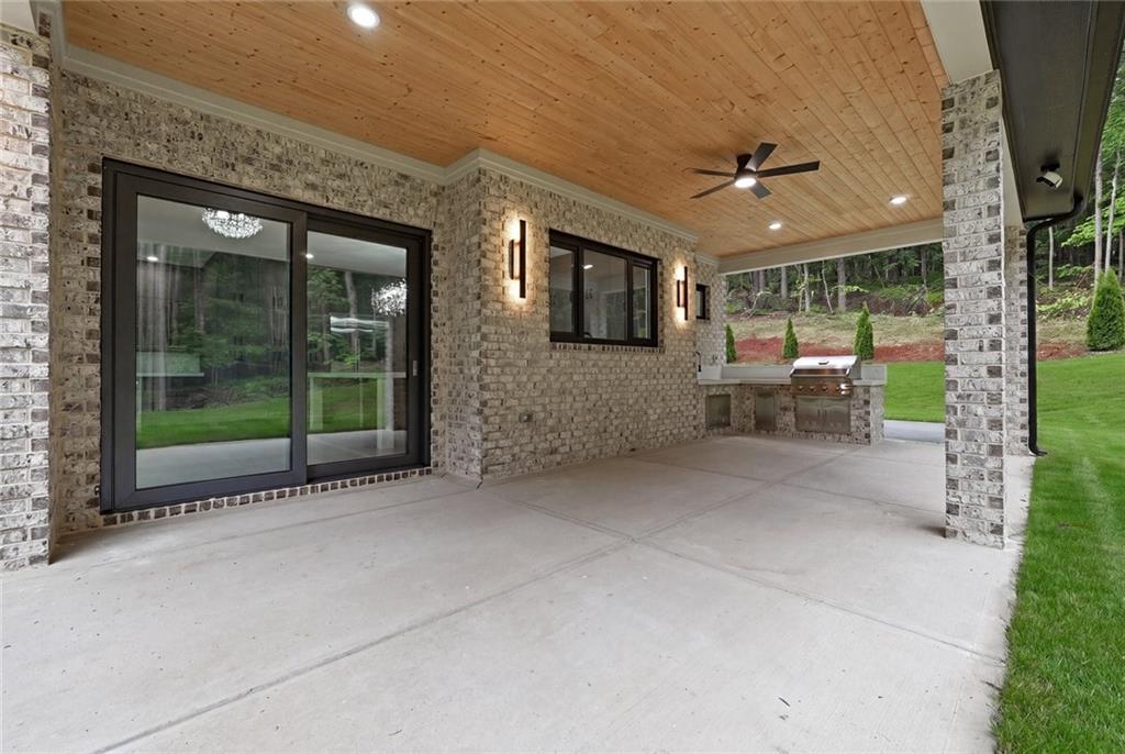 1563 Whitley Road Dacula, GA 30019 - Photo 38 of 44 a view of a patio with a tv