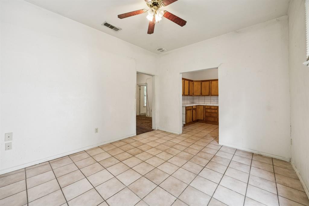 909 East High Street Terrell, TX 75160 - Photo 11 of 24 a view of an empty room with a ceiling fan