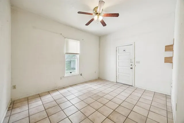 a view of an empty room and window