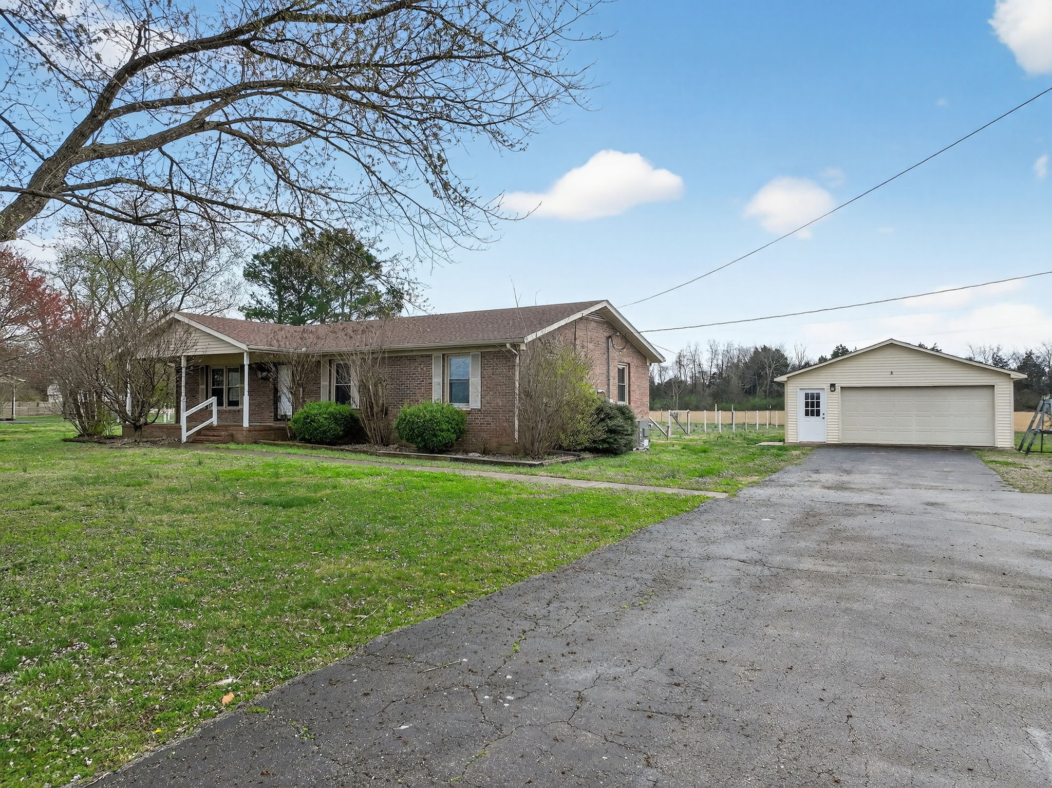 4377 Windrow Road Rockvale, TN 37153 - Photo 2 of 22 a front view of a house with a yard and trees