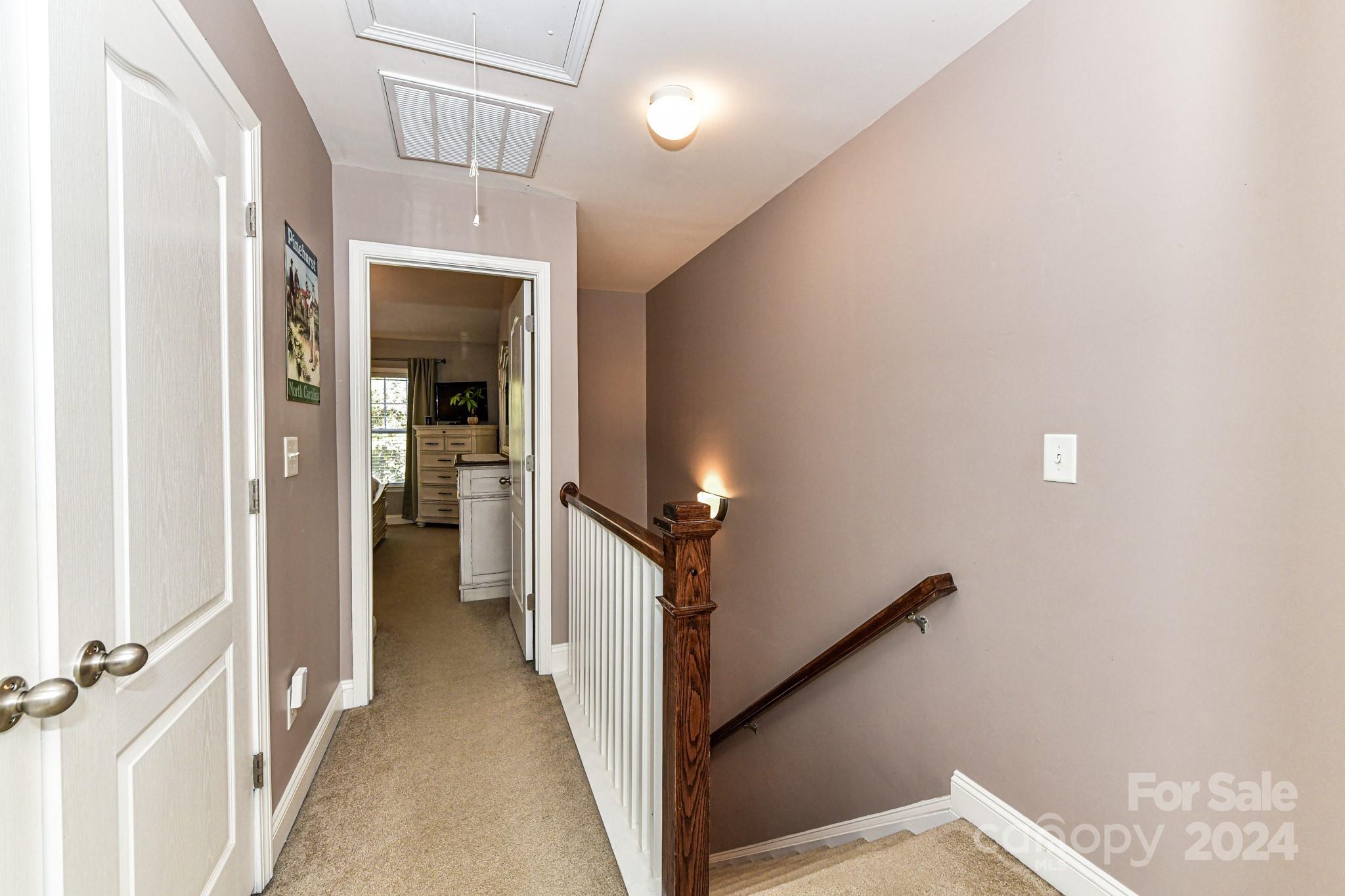 331 Hurston Circle Charlotte, NC 28208 - Photo 12 of 28 a view of a hallway with a white walls and stairs