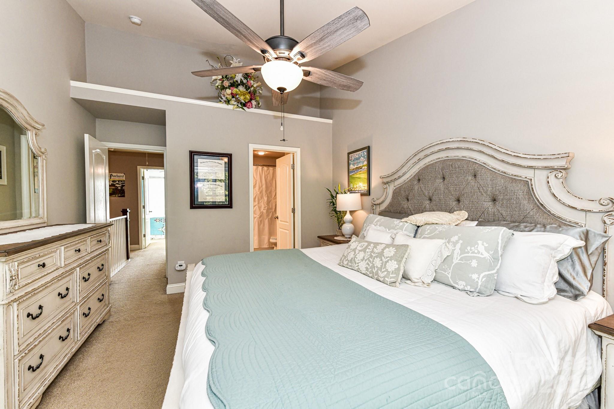 331 Hurston Circle Charlotte, NC 28208 - Photo 14 of 28 a bedroom with a bed and ceiling fan