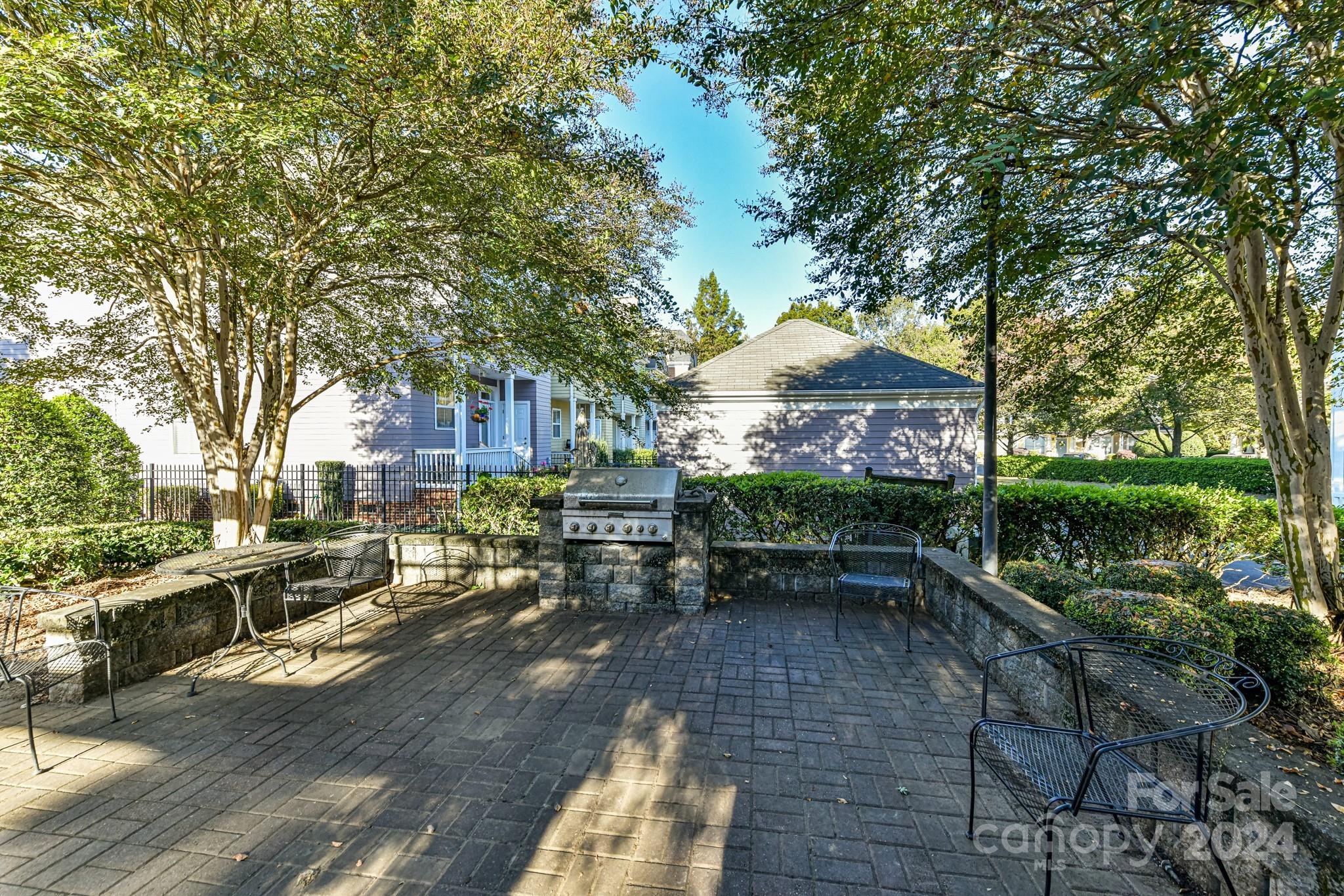 331 Hurston Circle Charlotte, NC 28208 - Photo 27 of 28 a view of a chairs and table in backyard of the house