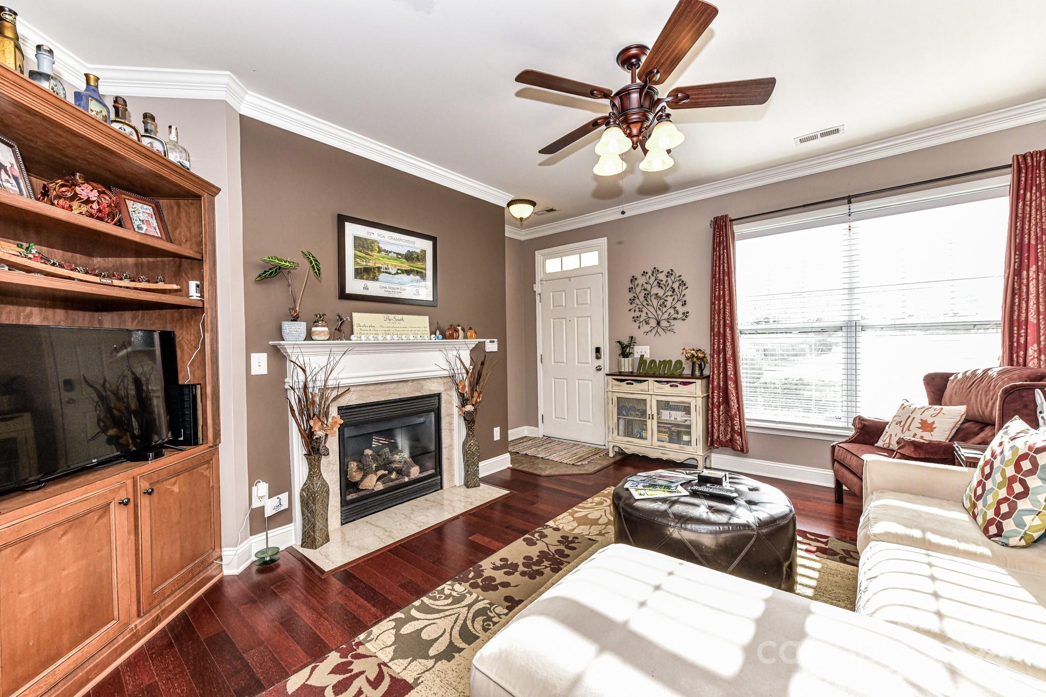 331 Hurston Circle Charlotte, NC 28208 - Photo 4 of 28 a living room with furniture fireplace and flat screen tv