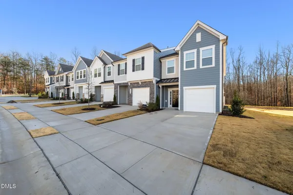 a view of multiple house with a yard