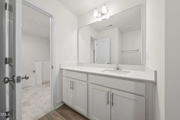 a bathroom with a bathtub shower and toilet
