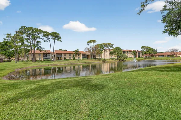 a view of a lake with houses in the back