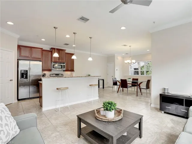 a view of kitchen with dining table and chairs